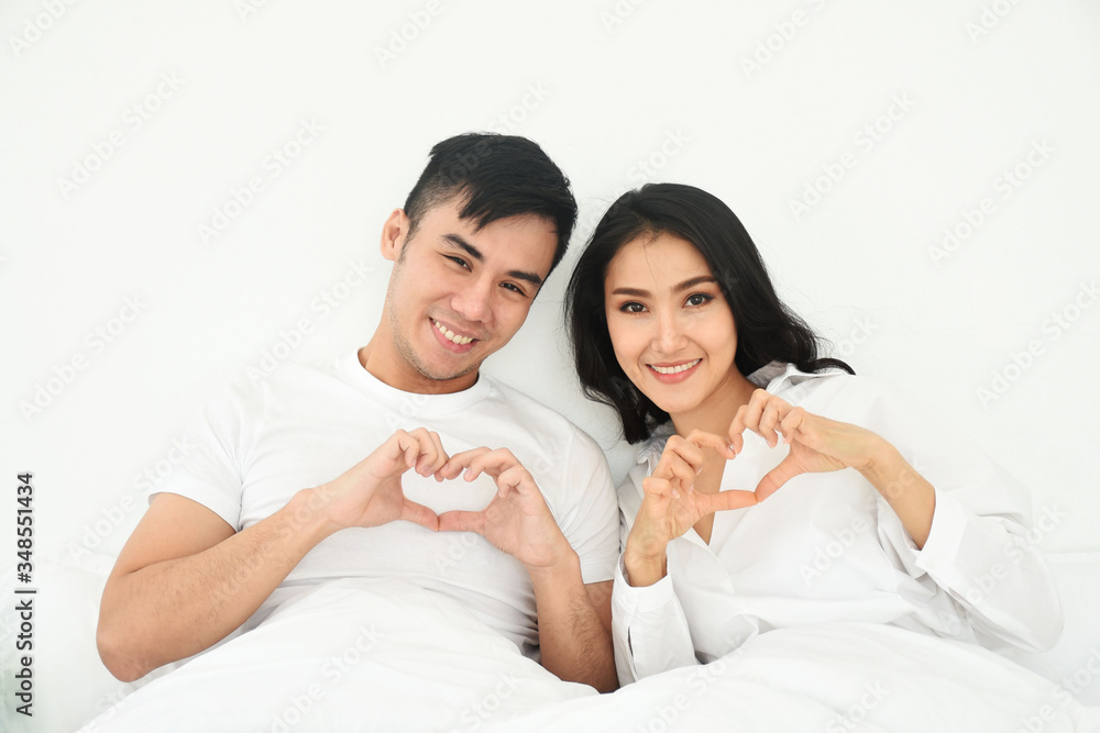 love couple make a heart shape tool in the bedroom love couple make a heart shape tool in the bedroom