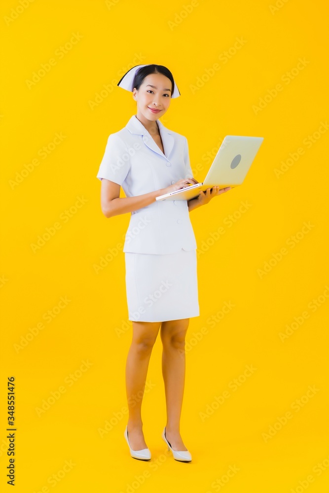 Portrait beautiful young asian woman thai nurse with laptop Portrait beautiful young asian woman thai nurse with laptop