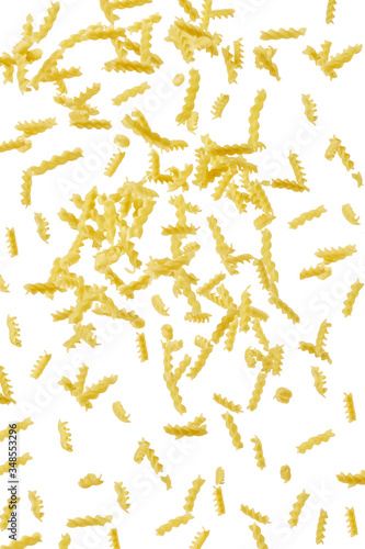 Italian flying raw pasta isolated on white background. macaroni fusilli falling background