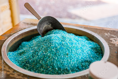 Dead Sea colorful salt and scoop on a buckets at a souvenir shop in Kalia Beach, West Bank.