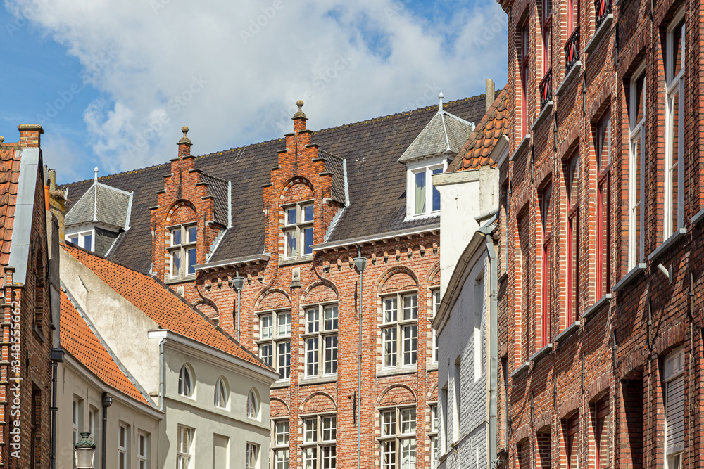 red brick houses on the narrow street of Bruges