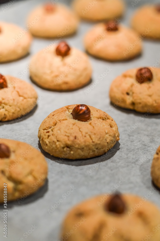 Hazelnut cookies on baking sheet close up