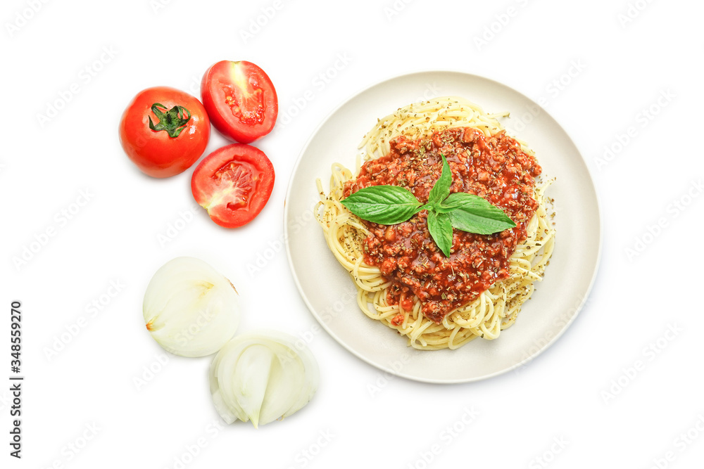Top view Italian homemade spaghetti bolognese  topped with a tasty tomato and ground beef bolognese sauce and fresh basil on white background