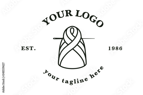 Braid hair logo. doll sewn of ball of wool with a needle