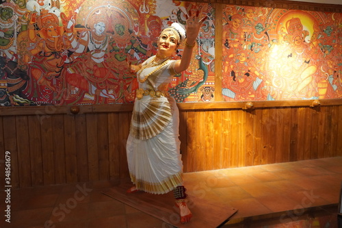 Wax figure of Indian woman perform Kerala Mohiniyattam dance with traditional makeup. Mohiniattam artist performance : Kochi India - May 2020 photo