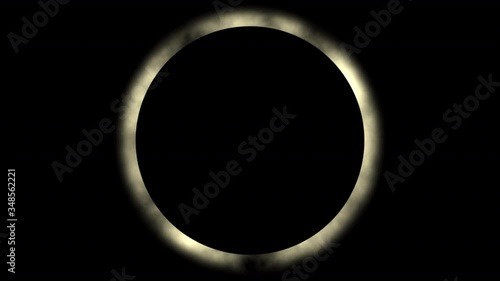 A camera zooming slowly into a total solar eclipse. photo