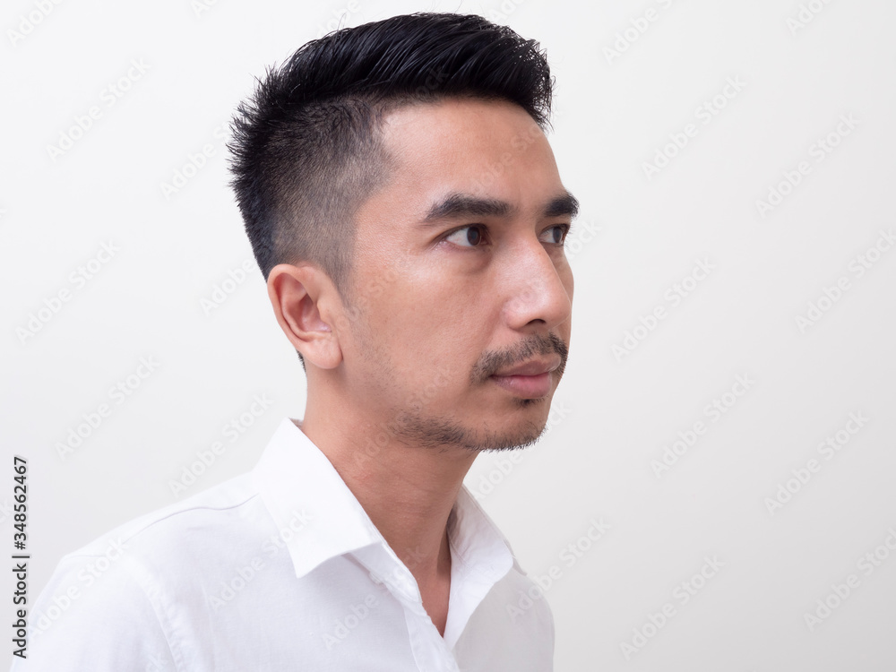 Young Asian man isolated on white background looking sideways Young Asian man isolated on white background looking sideways