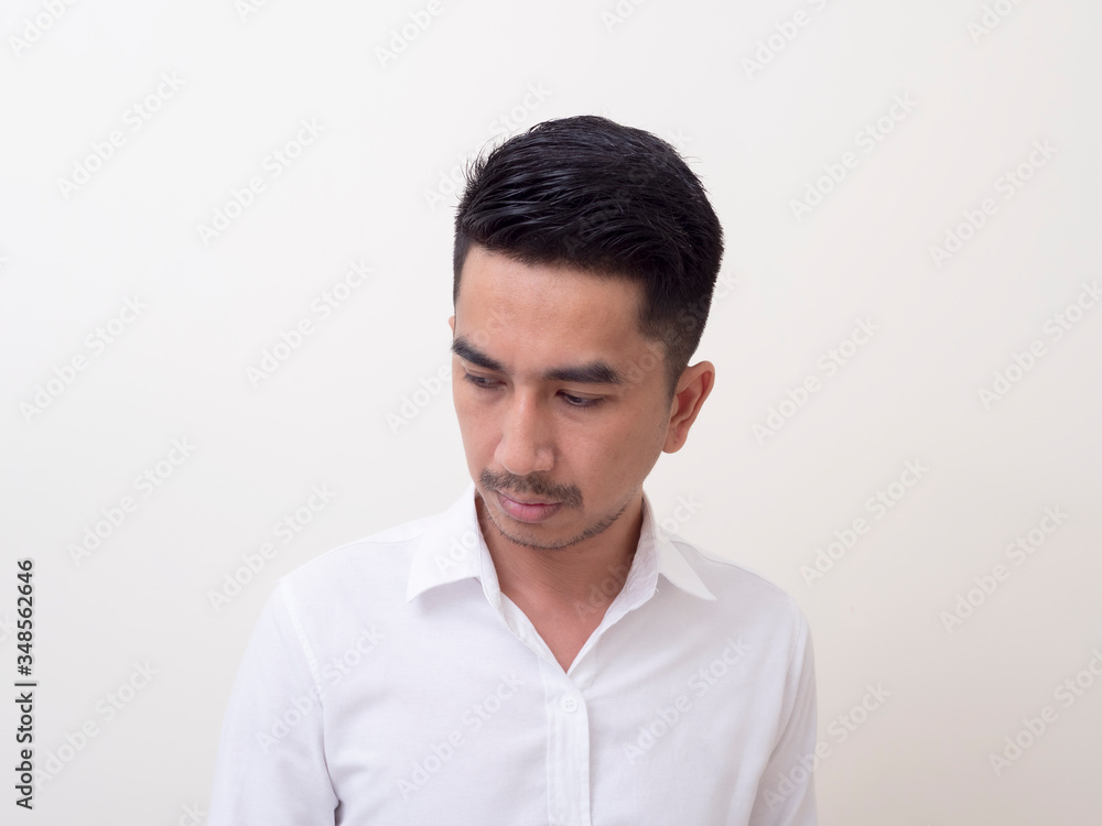 Young Asian man isolated on white background looking sideways Young Asian man isolated on white background looking sideways