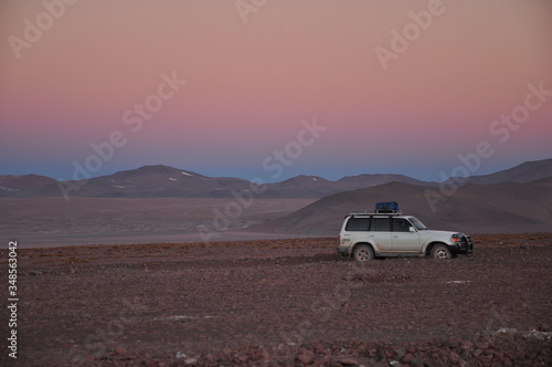 sunset in Bolivian desert snowy mountain 