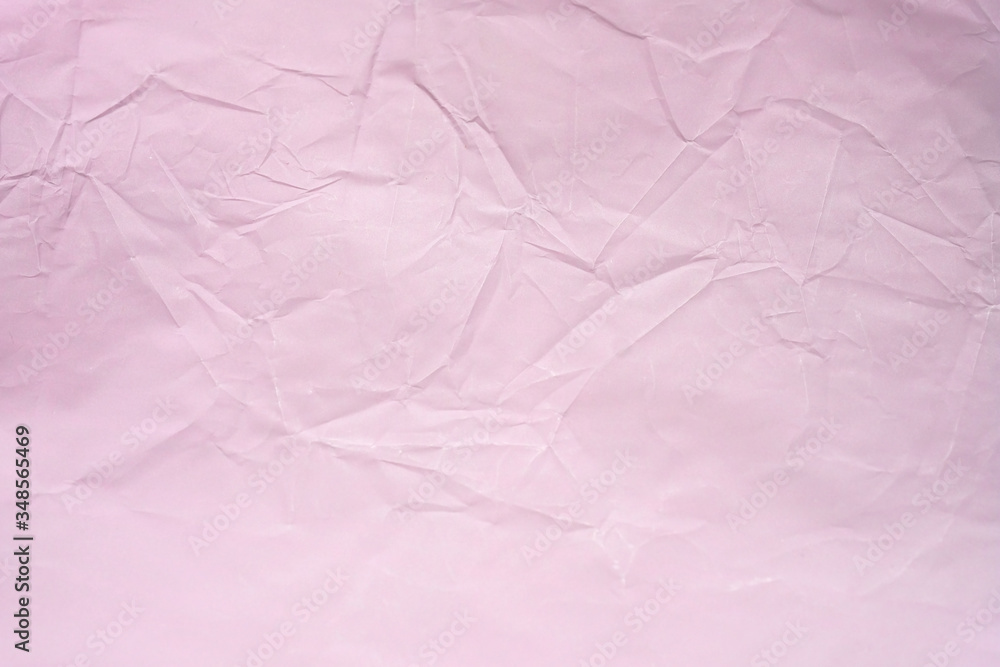 Pink crumpled paper background. Crumpled smooth paper texture top view. Abstract pink Background for Design. copy space