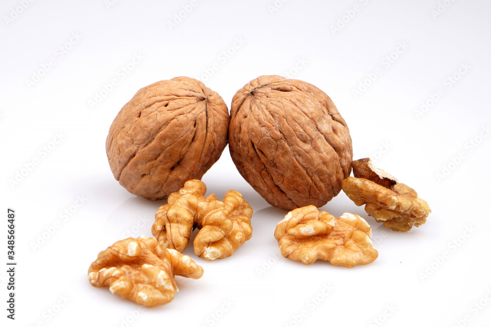 Useful organic walnuts, close-up, isolated on white background. Useful organic walnuts, close-up, isolated on white background.