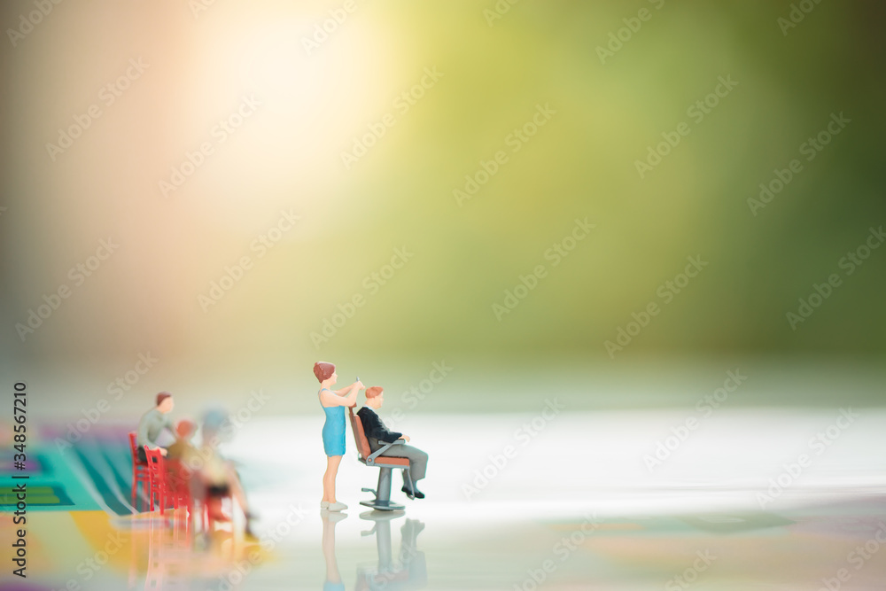 Miniature people: Man in barbershop hair care service with copy space for text using as background business concept. Miniature people: Man in barbershop hair care service with copy space for text using as background business concept.