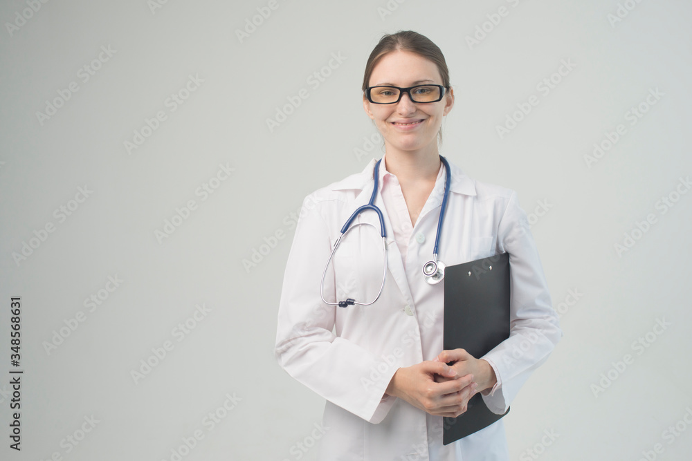 Portrait of an attractive young female doctor in white coat. Portrait of an attractive young female doctor in white coat.