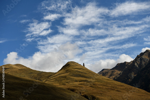 Medieval tower against a mountain landscape in Tusheti region