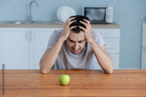 Young man suffering from an...