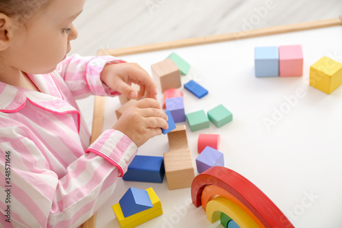 Little girl playing at home