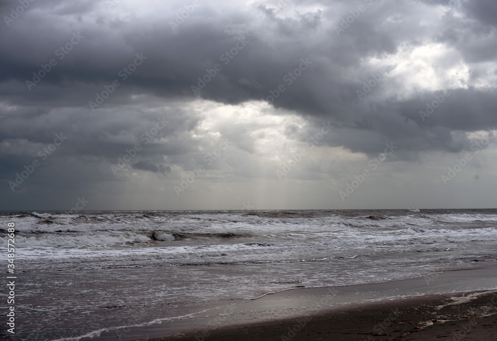 Ocean with white capped rippled water and cloudy sky in early morning Florida beach. Ocean with white capped rippled water and cloudy sky in early morning Florida beach.