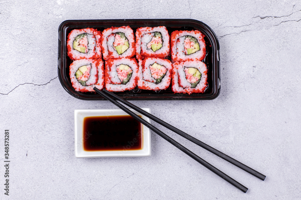 Making Rolled Sushi in a bamboo Sushi Mat Making Rolled Sushi in a bamboo Sushi Mat