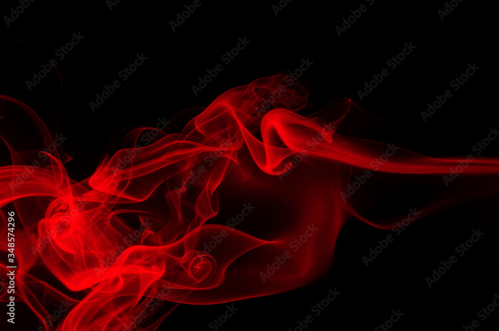 Fototapeta premium Red smoke on black background, fire design