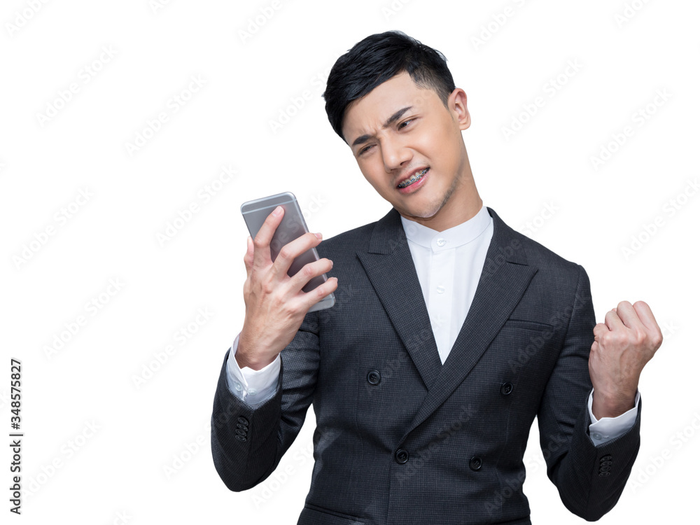 Handsome businessman feel excited while holding mobile phone with a fist in the other hand on white background with clipping path Handsome businessman feel excited while holding mobile phone with a fist in the other hand on white background with clipping path
