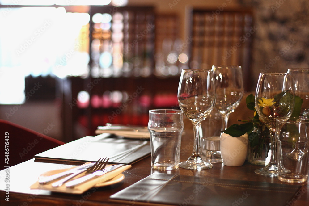 close up shot of restaurant table set up with tableware and glasses. Concept of dining, hospitality and catering. Horizontal image with free space for text close up shot of restaurant table set up with tableware and glasses. Concept of dining, hospitality and catering. Horizontal image with free space for text