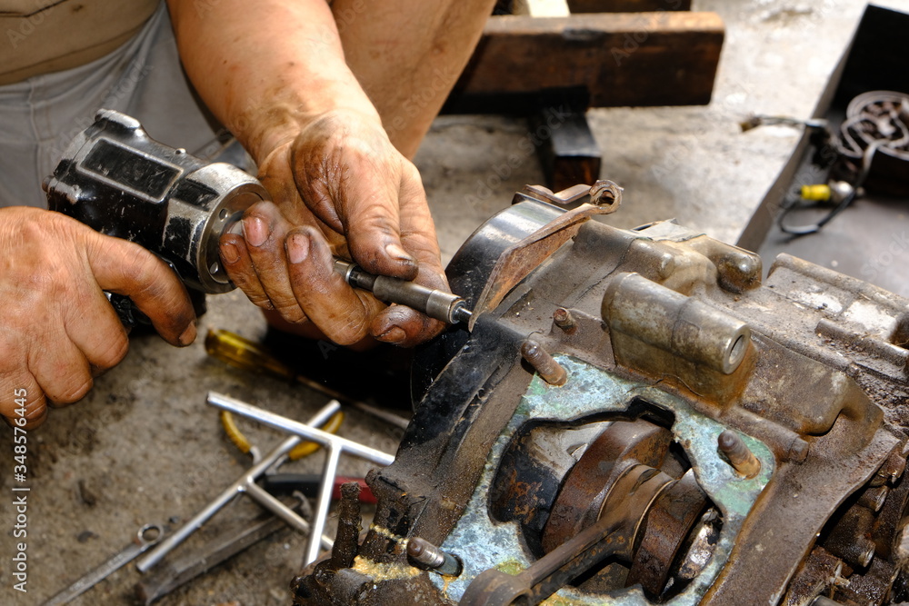 The motorcycle carburetor is waiting for maintenance and repair and the engine and mechanic check the engine. The motorcycle carburetor is waiting for maintenance and repair and the engine and mechanic check the engine.