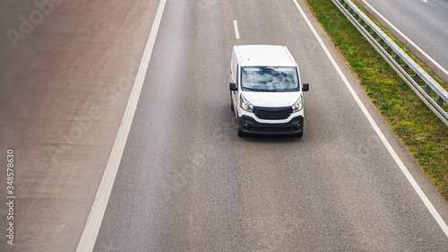 fast vans traveling on the highway © Igor