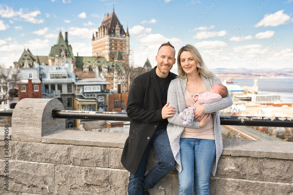 A Couple with baby in front of Chateau Frontenac at Quebec city Canada