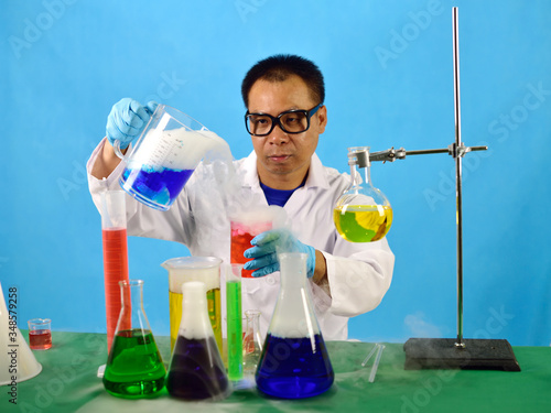 Asian man scientist working with chemical in research laboratory