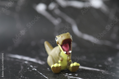 T REX Dinosaurs model on black background photo