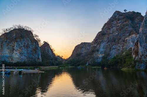 The Tourists traveling to Khao Ngu rock park, the rocky mountain park that surrounds the pool in the evening in Ratchaburi, Thailand.