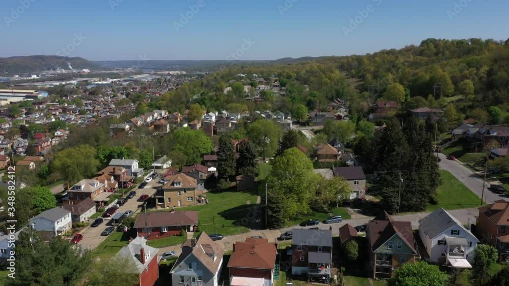 A slowly moving forward aerial establishing shot of a typical Pennsylvanian residential neighborhood. Pittsburgh suburbs. Flown with FAA authorization. A slowly moving forward aerial establishing shot of a typical Pennsylvanian residential neighborhood. Pittsburgh suburbs. Flown with FAA authorization.