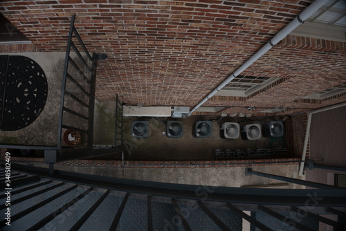 Top down view of outside air conditioners from stairs