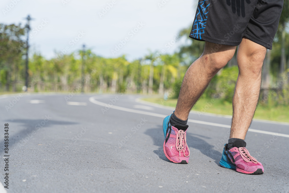 Close-up of Athlete shoes while running and walking in park. Sport and exercise concept