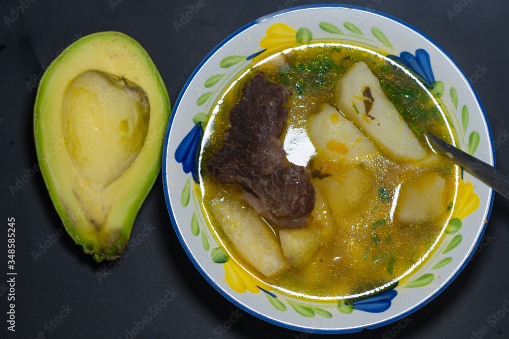 typical Colombian dish. Colombian food with avocado. Colombian vegetable soup with avocado.
typical Colombian dish. Colombian food with avocado. Colombian vegetable soup with avocado.
