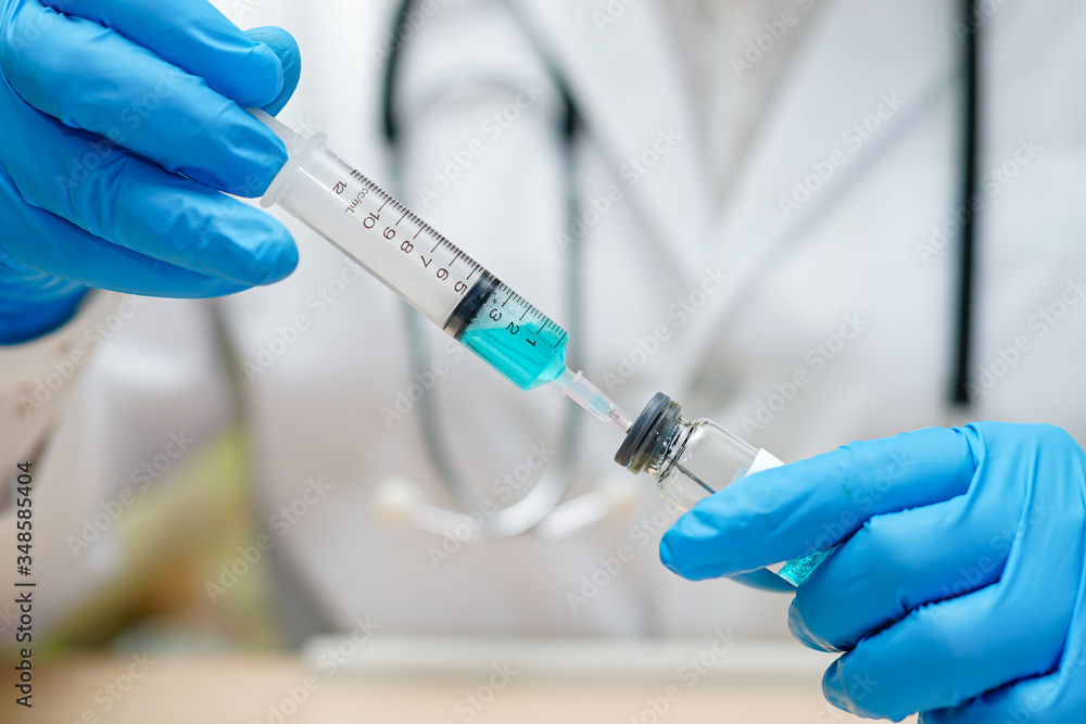Fototapeta premium Novel Coronavirus Covid-19 vaccine development medical with syringe for doctor use to treat pneumonia illness patients.