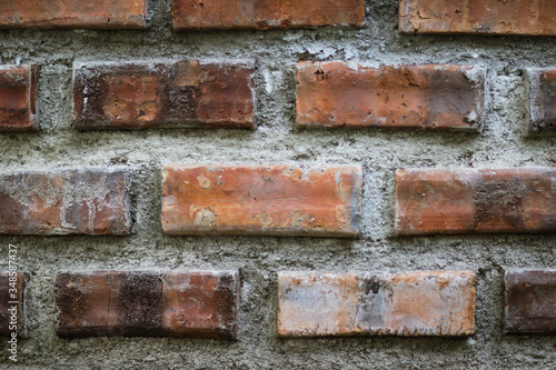 Close-up details of a orange-brown brick wall. red brick wall close up, old brick background. red brick wall. vintage style.