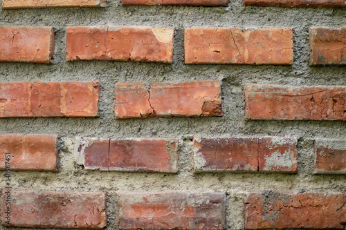 Close-up details of a orange-brown brick wall. red brick wall close up, old brick background. red brick wall. vintage style.