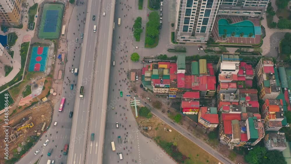 HANOI, VIETNAM - APRIL, 2020: Aerial panorama view of the urban multi-level motorway of one of the districts of Hanoi. HANOI, VIETNAM - APRIL, 2020: Aerial panorama view of the urban multi-level motorway of one of the districts of Hanoi.