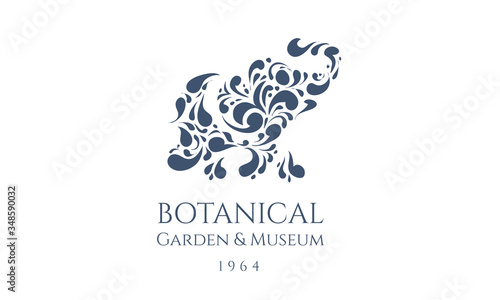 Indian ornamental elephant logotype. Floral animal logo. Label design for kids art school. Mandala doodle sign for tea or tea room