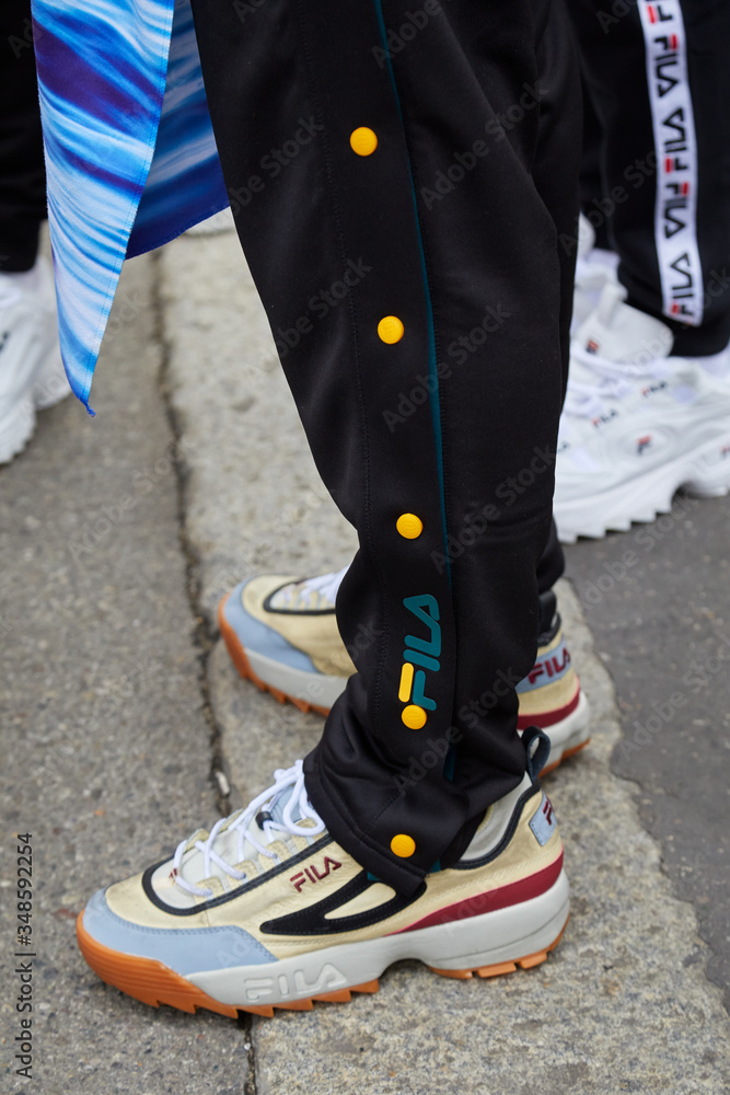 duda bolita escanear Man with Fila sneakers and black suit trousers on September 22, 2019 in  Milan, Italy foto de Stock | Adobe Stock