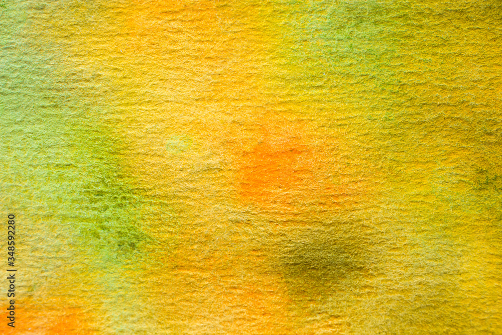 Abstract hand painted watercolor background. Green, yellow and brown shades