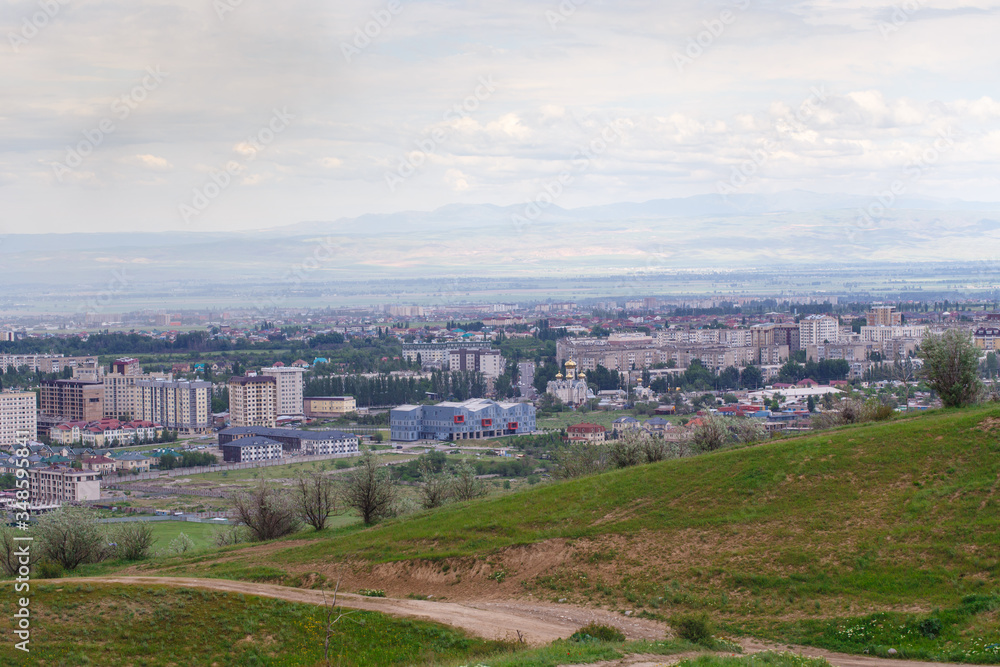 View of the city from the mountain. Summer landscape. Kyrgyzstan, Bishkek