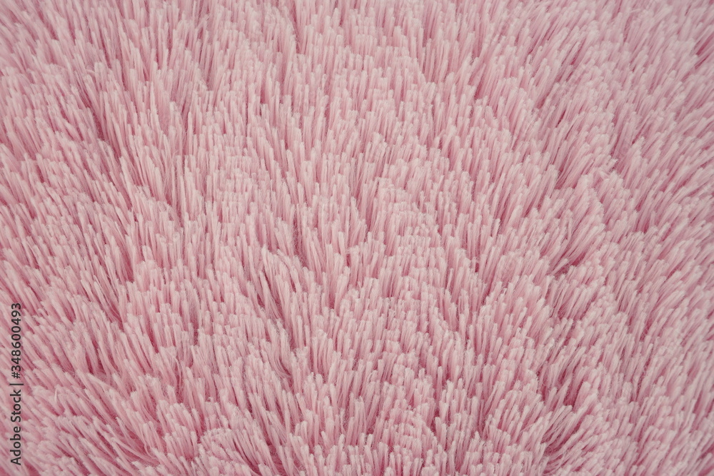 Close-up pink, soft, fluffy wool with long pile. Faux fur texture, background. Close-up pink, soft, fluffy wool with long pile. Faux fur texture, background.