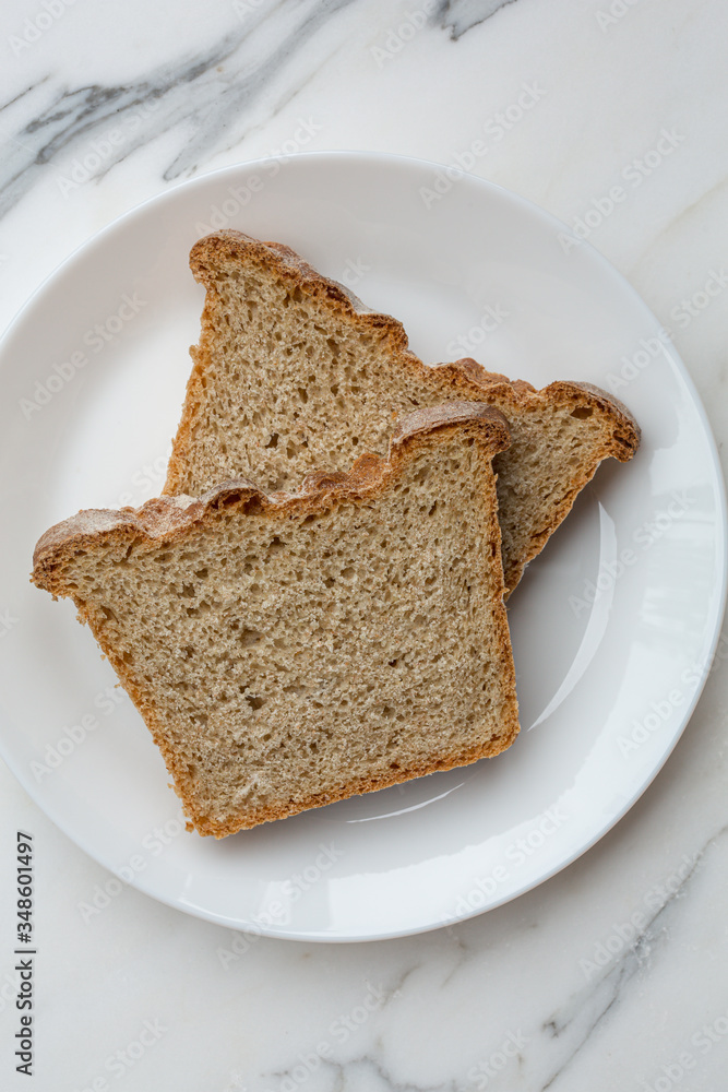 Directly above shot of two slices of bread on plate Directly above shot of two slices of bread on plate