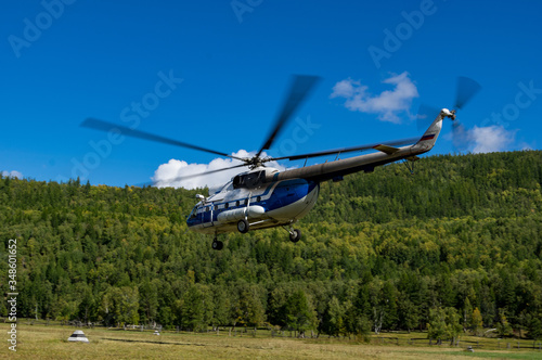 takeoff and landing helicopter in the mountains