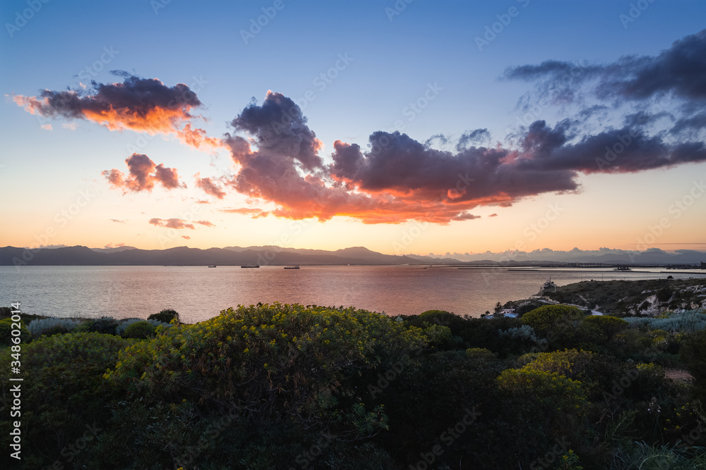 Moody sunset view of Calamosca hill and the bay of Cagliar