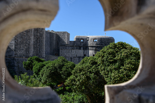 View of the fortress, wall, through a window in Dubrovnik, formerly Ragusa, city located on the Dalmatian coast, Croatia, Europe