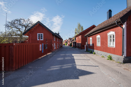Falu red houses in the old town Trosa with its narrow canal and classic old houses south of Stockholm. 