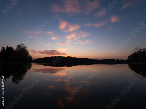 Amazing sunset, with beautiful sky reflections in the water of Hancza lake. Suwalski landscape park, Podlaskie, Poland © Beata